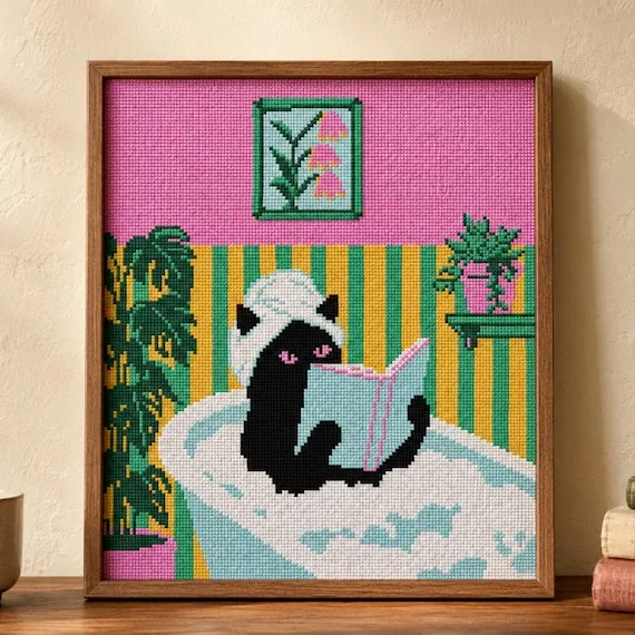 Stitch Jam Studio counted cross-stitch pattern: Cat in bath reading